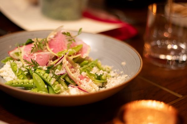 Themed, family-style dish with fresh vegetables served as part of Metro Private Cinema’s in-suite dining experience